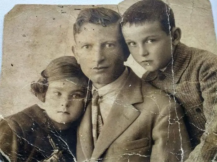 Damaged family portrait photo restored to perfection using best AI photo restoration online