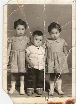 Black and white photo of twin girls colorized to perfection using best AI photo colorizer online